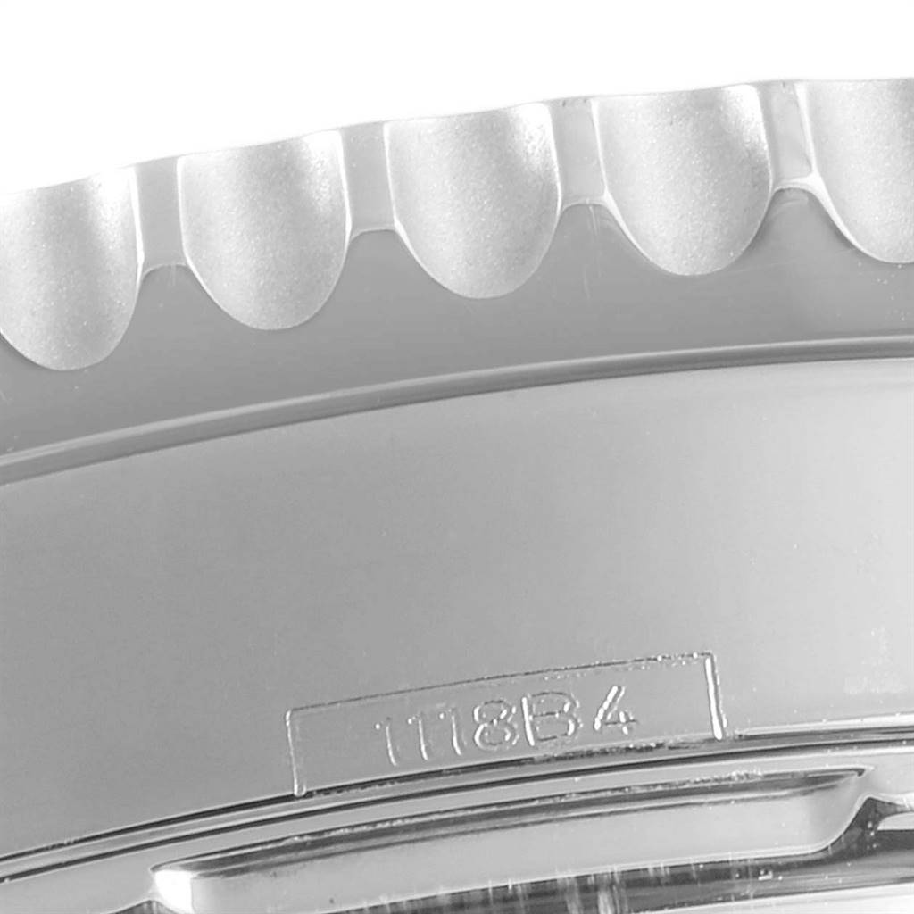 This is a close-up shot of the bezel and part of the case of a Breitling Navitimer AB0121211C1A1 Men's Stainless Steel Blue Dial AB0121211C1A1 Men's Stainless Steel Blue Dial watch, showing the edge detailing and serial number.