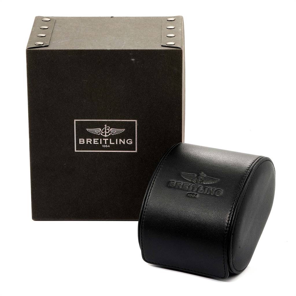 The image shows the packaging and case for the Breitling Navitimer C23340 Men
s Steel and Gold (two tone) Black Dial C23340 Men
s Steel and Gold (two tone) Black Dial watch, featuring both a box and a leather case.