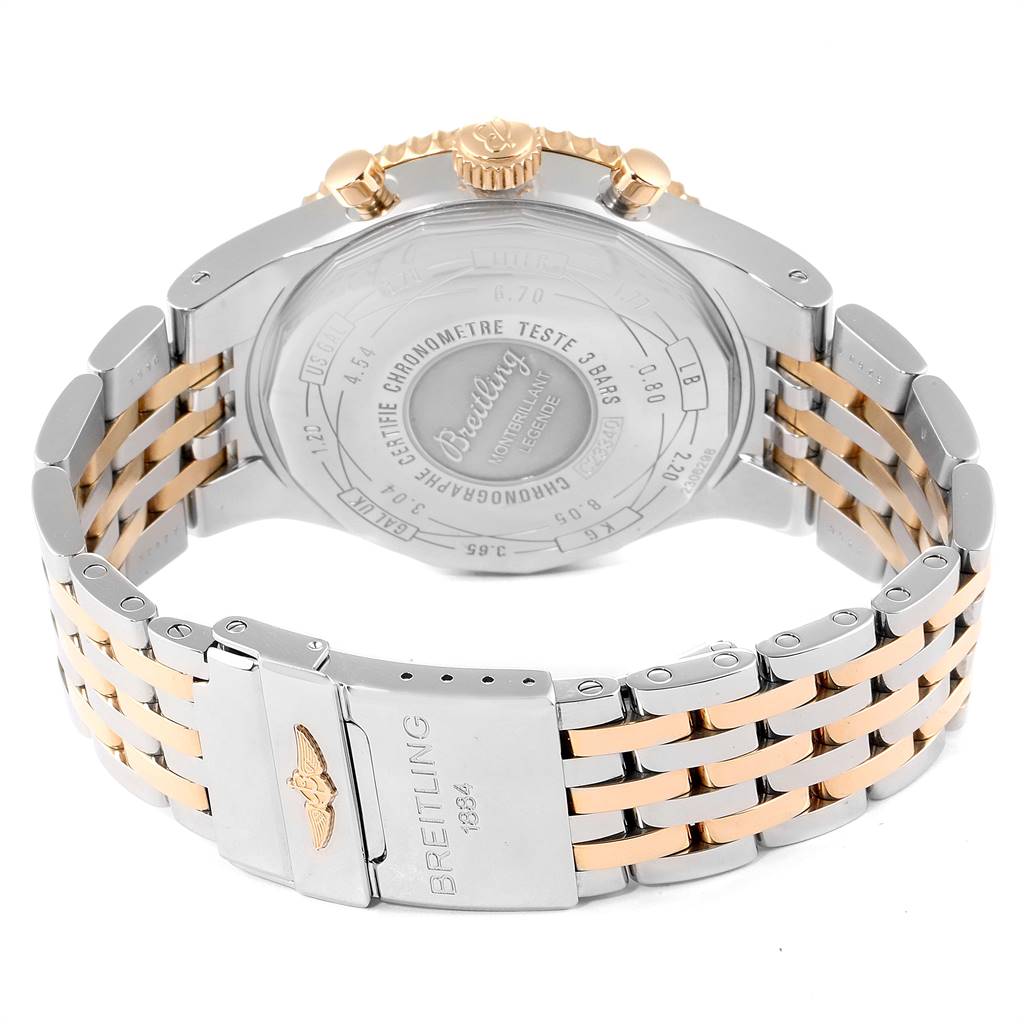 The image shows the back case and bracelet of a Breitling Navitimer C23340 Men
s Steel and Gold (two tone) Black Dial C23340 Men
s Steel and Gold (two tone) Black Dial watch, highlighting the clasp and engraved details.