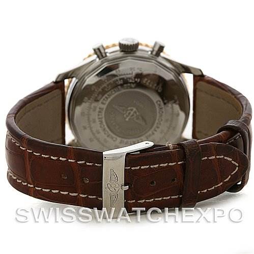 The image shows the back of a Breitling Navitimer D12322 Men's Stainless Steel Black Dial D12322 Men's Stainless Steel Black Dial watch with a brown leather strap and a polished clasp.