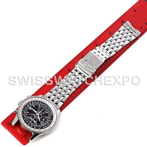The Breitling Navitimer A2133012/B571 Men's Stainless Steel Black Dial A2133012/B571 Men's Stainless Steel Black Dial watch is shown from a top-down angle, displaying the dial, bezel, and metal bracelet on a red measuring ruler.