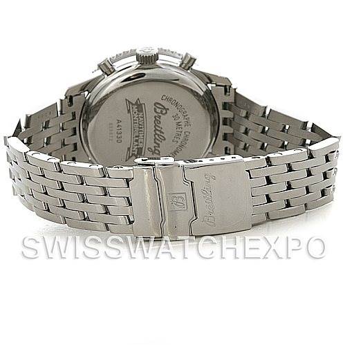 The image shows the back view of the Navitimer model by Breitling, featuring the case back and metal bracelet.