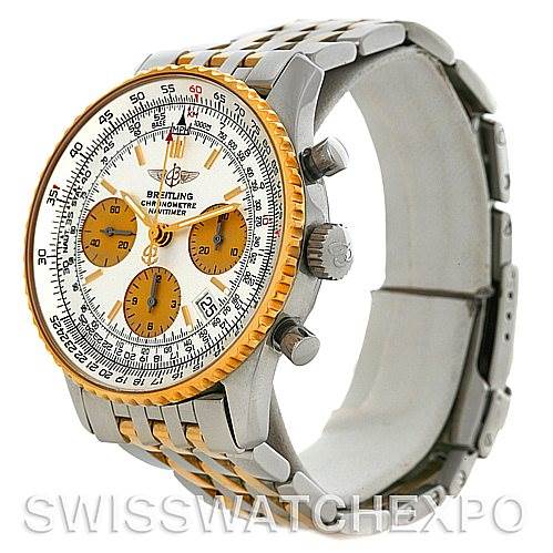 The image shows a Breitling Navitimer D23322 Men
s Stainless Steel Silver Dial D23322 Men
s Stainless Steel Silver Dial watch from a side angle, highlighting its crown, pushers, and two-tone bracelet.