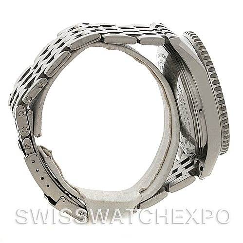 The image shows a side view of the Breitling Navitimer A24322 Men
s Stainless Steel Black Dial A24322 Men
s Stainless Steel Black Dial watch, highlighting the metal bracelet and the back of the watch case.