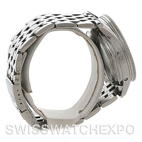 The image shows a side view of the Breitling Navitimer A19350 Men's Stainless Steel Silver Dial A19350 Men's Stainless Steel Silver Dial watch, highlighting the bezel, case, and metal bracelet.