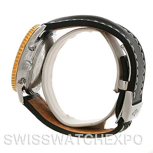 This side angle view of the Breitling Navitimer D22322 Men
s Stainless Steel White Dial D22322 Men
s Stainless Steel White Dial watch shows the leather strap, buckle, side case, and the gold bezel.