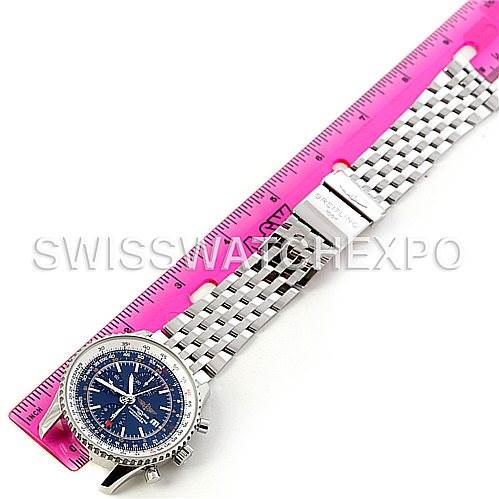 The image shows a Breitling Navitimer A24322 Men's Stainless Steel Blue Dial A24322 Men's Stainless Steel Blue Dial watch laid flat next to a pink ruler, displaying its bracelet and blue dial from an overhead angle.