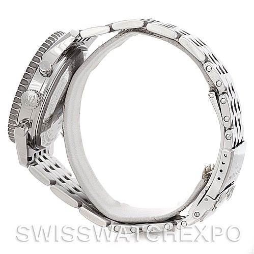 The image shows a side profile of a Breitling Navitimer A21330 Men's Stainless Steel Beige Dial A21330 Men's Stainless Steel Beige Dial watch highlighting its metal bracelet and case.