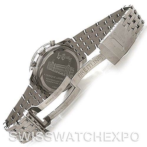 The image shows a Navitimer model by Breitling from the back, displaying its case back and stainless steel bracelet with a deployment clasp.