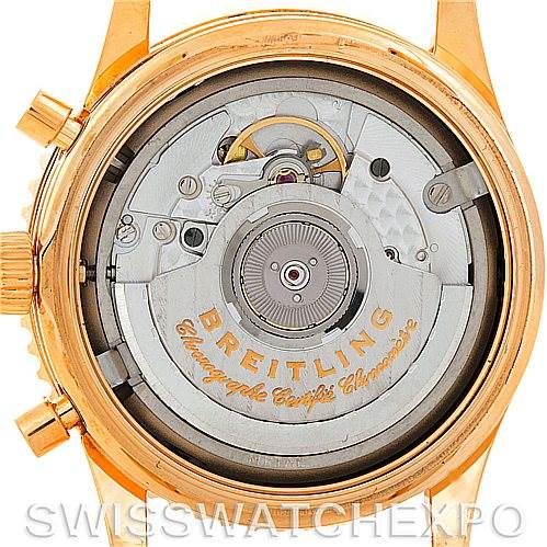 This image shows the back view of a Breitling Navitimer H41330 Men's Rose Gold Silver Dial H41330 Men's Rose Gold Silver Dial watch, highlighting its intricate movement and mechanics.