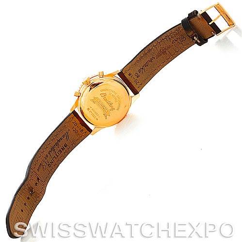 The Breitling Navitimer H41330 Men's Rose Gold Silver Dial H41330 Men's Rose Gold Silver Dial watch is shown from the back angle, displaying the case back and leather strap with a metal buckle.