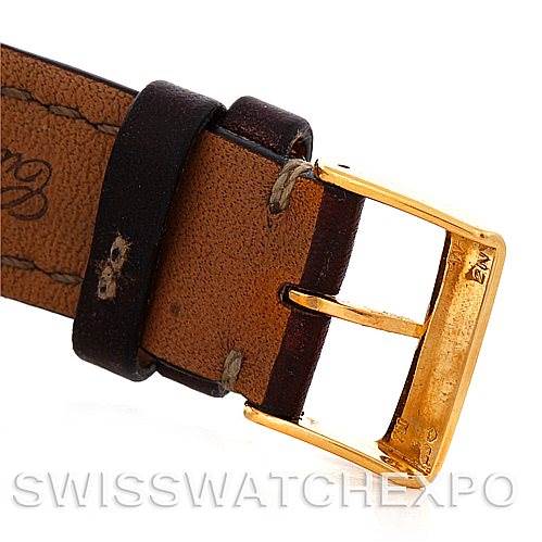 The image shows a close-up of the leather strap and gold buckle of a Breitling Navitimer K33030 Men's Yellow Gold Blue Dial K33030 Men's Yellow Gold Blue Dial watch.