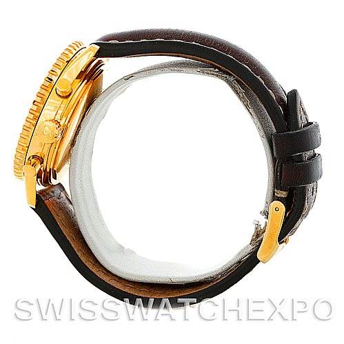 This is a side view of a Breitling Navitimer K33030 Men's Yellow Gold Blue Dial K33030 Men's Yellow Gold Blue Dial watch, showing its crown, pushers, bezel, and leather strap.