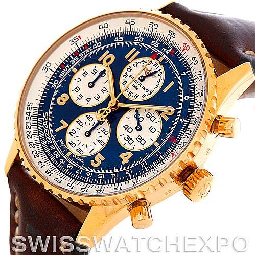 This image shows a close-up angled view of the face and gold case of a Breitling Navitimer K33030 Men's Yellow Gold Blue Dial K33030 Men's Yellow Gold Blue Dial watch, featuring a brown leather strap.