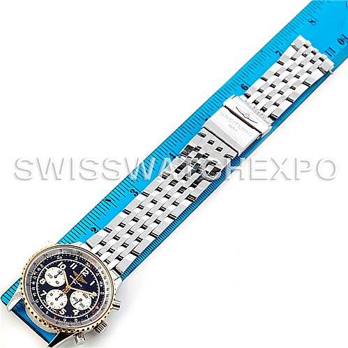 The image shows a Breitling Navitimer D30022 Men's Stainless Steel Black Dial D30022 Men's Stainless Steel Black Dial watch laid flat alongside a blue ruler, displaying the face, bezel, and full metal bracelet.