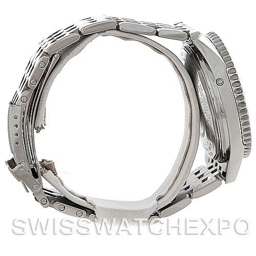 The image shows a side view of a Breitling Navitimer A21330 Men
s Stainless Steel Beige Dial A21330 Men
s Stainless Steel Beige Dial watch, focusing on the bracelet, side of the case, and part of the bezel.