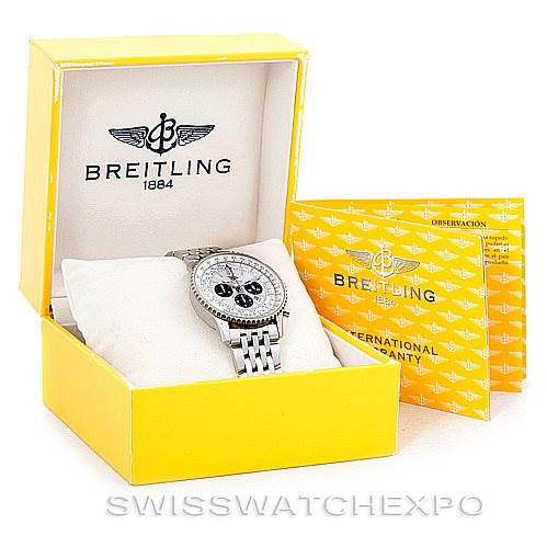 The watch faces forward, displayed in its yellow Breitling box with warranty documents, showcasing the Navitimer model's bracelet and dial.