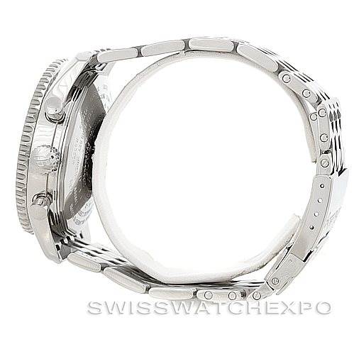 The image shows the side view of a Breitling Navitimer A24322 Men
s Stainless Steel White Dial A24322 Men
s Stainless Steel White Dial watch, featuring the case, bezel, crown, lugs, and parts of the metal bracelet.