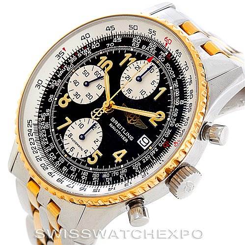 This image shows a Breitling Navitimer D13020 Men's Stainless Steel Black Dial D13020 Men's Stainless Steel Black Dial watch, focusing on its dial, bezel, and crown, with a partial view of its two-tone bracelet.