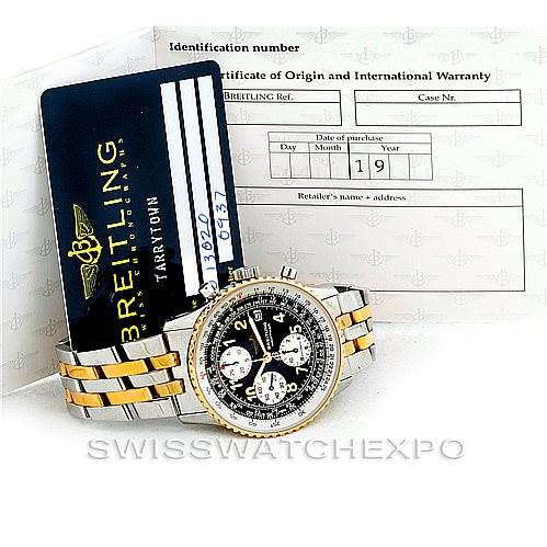 The image shows a Breitling Navitimer D13020 Men's Stainless Steel Black Dial D13020 Men's Stainless Steel Black Dial watch in a front angle view, accompanied by a Breitling warranty card and certificate of origin.
