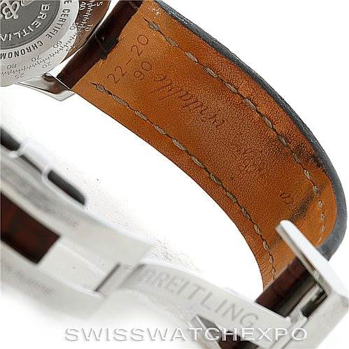 The image shows the leather strap, clasp, and partially the back casing of a Breitling Navitimer D23322 Men's Stainless Steel Silver Dial D23322 Men's Stainless Steel Silver Dial watch.