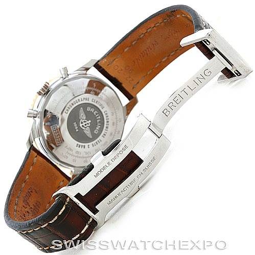 The image shows the backside and clasp of a Breitling Navitimer D23322 Men's Stainless Steel Silver Dial D23322 Men's Stainless Steel Silver Dial, focusing on the watch's open leather strap and engraved clasp.