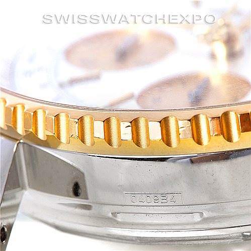 The image shows a close-up angle of the bezel and part of the stainless steel case of a Breitling Navitimer D23322 Men's Stainless Steel Silver Dial D23322 Men's Stainless Steel Silver Dial watch.