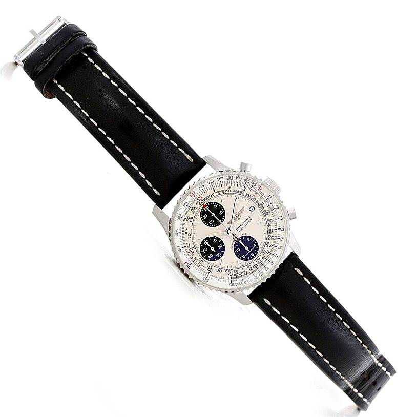 This Breitling Navitimer A13330 Men's Silver Dial A13330 Men's Silver Dial watch is shown at an angle featuring a black leather strap, case, dial, and chronograph subdials.
