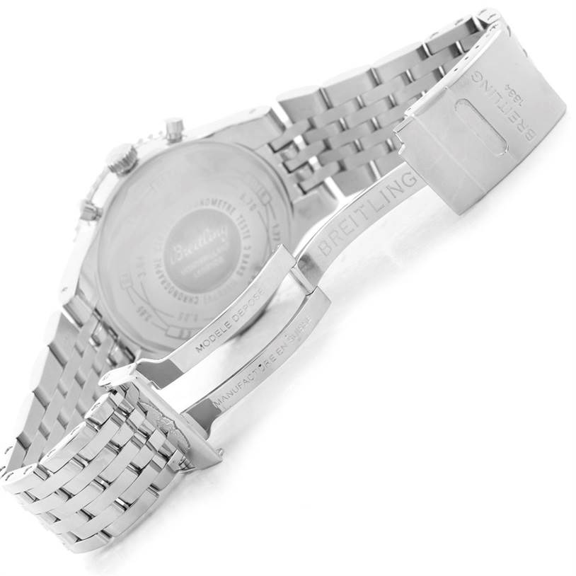The image shows the back and partially opened clasp of a Navitimer model by Breitling.
