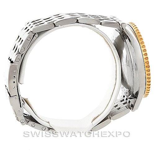 The image shows a side view of the Breitling Navitimer D13022 Men
s Stainless Steel Blue Dial D13022 Men
s Stainless Steel Blue Dial watch, highlighting the bracelet and partially the bezel.