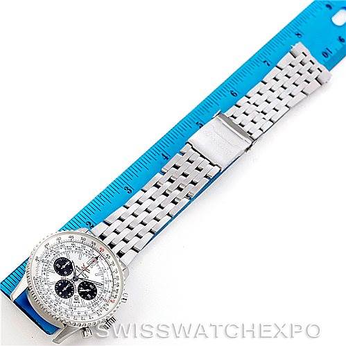 The image shows a Breitling Navitimer A41322 Men
s Stainless Steel Silver Dial A41322 Men
s Stainless Steel Silver Dial watch laid flat, displaying its case, dial, and metal bracelet alongside a blue ruler for scale.