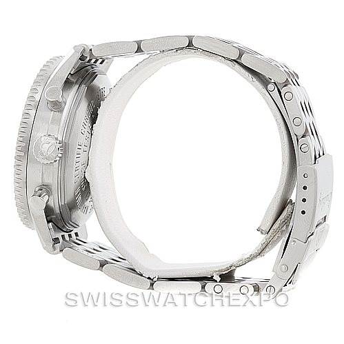 The image shows the side profile of a Breitling Navitimer A41322 Men
s Stainless Steel Silver Dial A41322 Men
s Stainless Steel Silver Dial watch, displaying the case, crown, and partially open metal bracelet.
