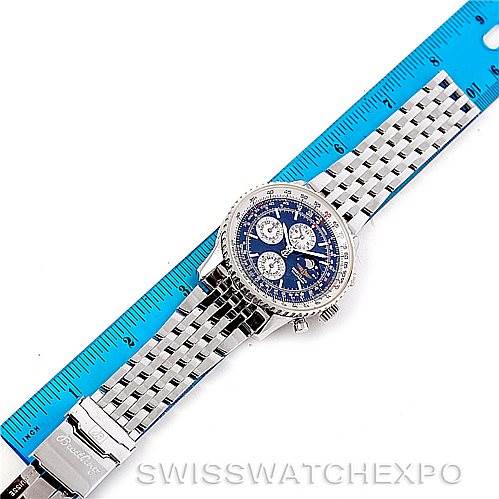 The image shows a top-down view of a Breitling Navitimer A19340 Men's Stainless Steel Blue Dial A19340 Men's Stainless Steel Blue Dial watch with a blue dial, placed next to a blue ruler.