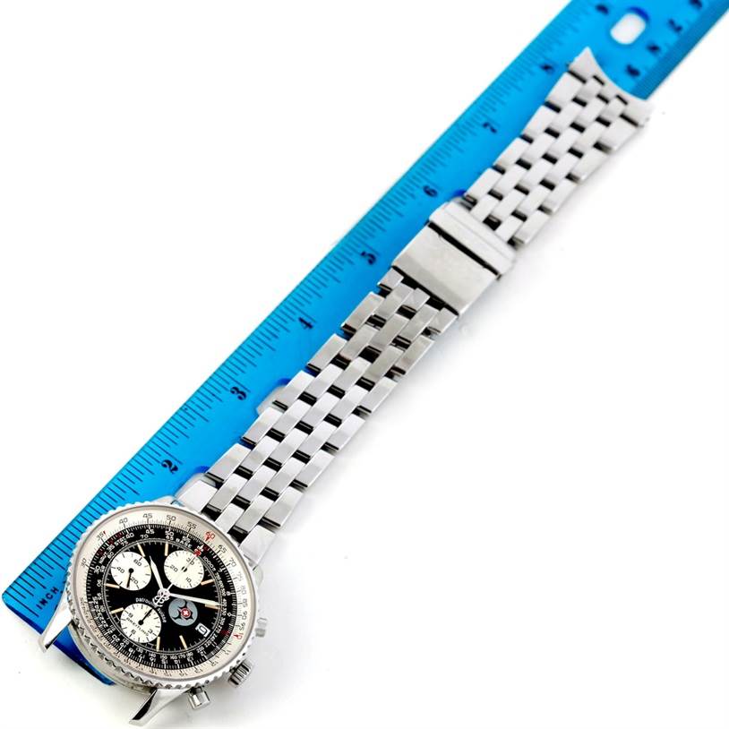 The Breitling Navitimer A13022 Men
s Stainless Steel Black Dial A13022 Men
s Stainless Steel Black Dial watch is shown from an overhead angle, highlighting its dial and metal bracelet beside a ruler.