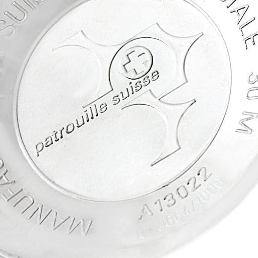 This image shows the case back of a Breitling Navitimer A13022 Men
s Stainless Steel Black Dial A13022 Men
s Stainless Steel Black Dial watch, featuring the "patrouille suisse" inscription and limited edition numbering.