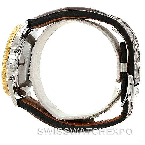 The image shows a side view of a Breitling Navitimer 81600 Men
s Stainless Steel Black Dial 81600 Men
s Stainless Steel Black Dial watch, highlighting the case, crown, pushers, and leather strap.