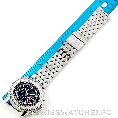 The image shows a Breitling Navitimer A24322 Men's Stainless Steel Black Dial A24322 Men's Stainless Steel Black Dial watch laid flat on a surface with a blue ruler, displaying the face and metal bracelet.