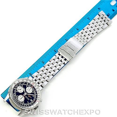 The image shows a top-down view of a Breitling Navitimer A13330 Men's Stainless Steel Black Dial A13330 Men's Stainless Steel Black Dial watch with its blue face and silver bracelet measured against a blue ruler.