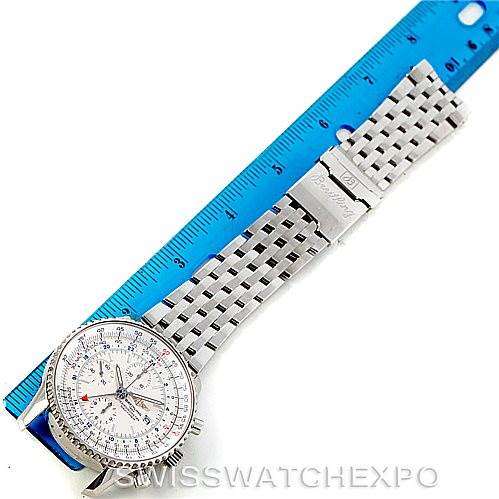 The Breitling Navitimer A24322 Men's Stainless Steel White Dial A24322 Men's Stainless Steel White Dial watch is shown face-up alongside a ruler, highlighting the watch face and metal bracelet.