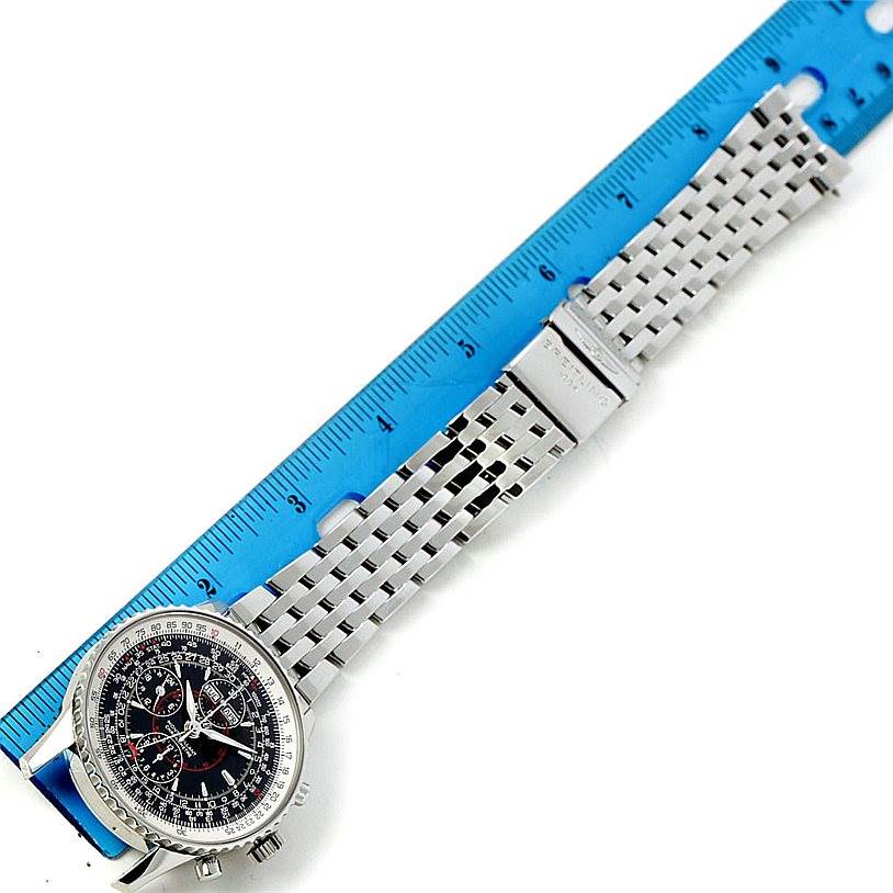 The image shows a Breitling Navitimer A21330 Men's Stainless Steel Black Dial A21330 Men's Stainless Steel Black Dial watch laid flat with a blue ruler beside it, highlighting the face and metal strap.