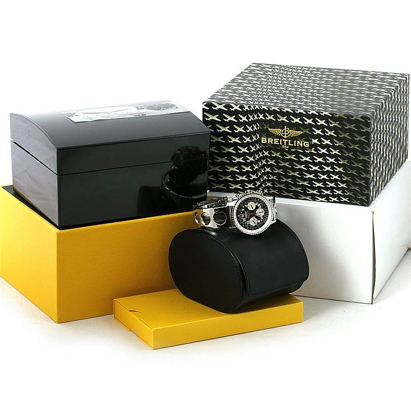 The Breitling Navitimer AB0210 Men's Stainless Steel Black Dial AB0210 Men's Stainless Steel Black Dial watch is shown at a front angle, accompanied by its packaging and boxes.