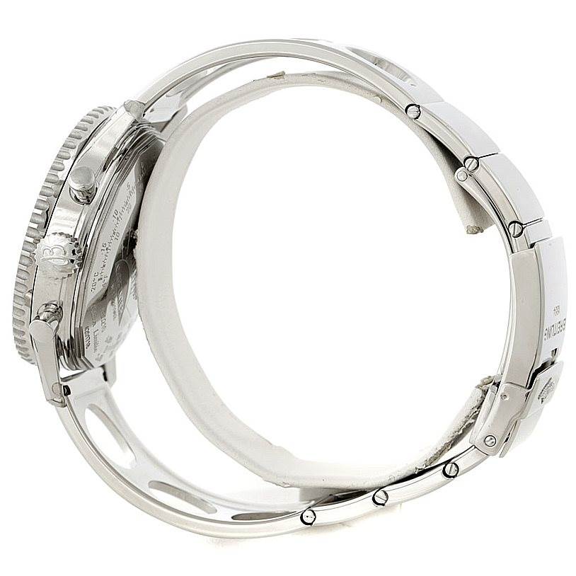 Side view of a Breitling Navitimer AB0210 Men's Stainless Steel Black Dial AB0210 Men's Stainless Steel Black Dial watch, showing the case, crown, lugs, and part of the metal bracelet.