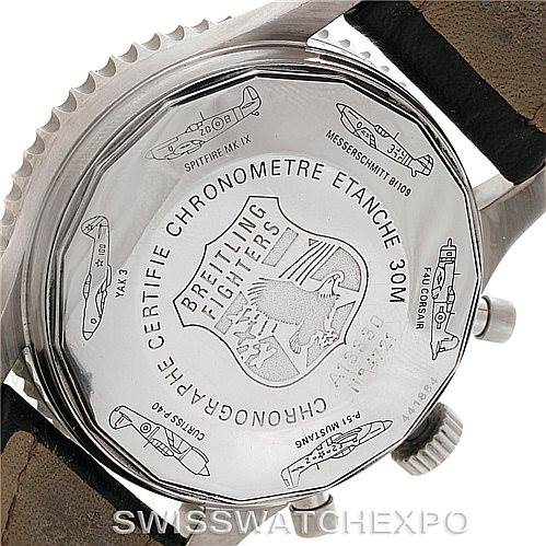 This image shows the back case of a Breitling Navitimer A13330 Men's Stainless Steel Silver Dial A13330 Men's Stainless Steel Silver Dial watch, including engravings of various fighter planes.