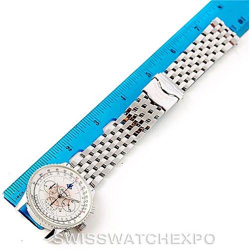 A Breitling Navitimer A41030 Men
s Stainless Steel Silver Dial A41030 Men
s Stainless Steel Silver Dial watch is shown from a top-down angle, displaying its face and stainless steel bracelet alongside a ruler for scale.