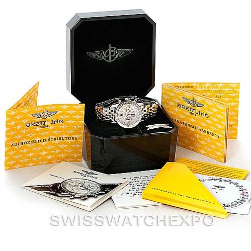 The image shows a Breitling Navitimer A41030 Men
s Stainless Steel Silver Dial A41030 Men
s Stainless Steel Silver Dial watch in its box, along with warranty cards, manuals, and a cleaning cloth.