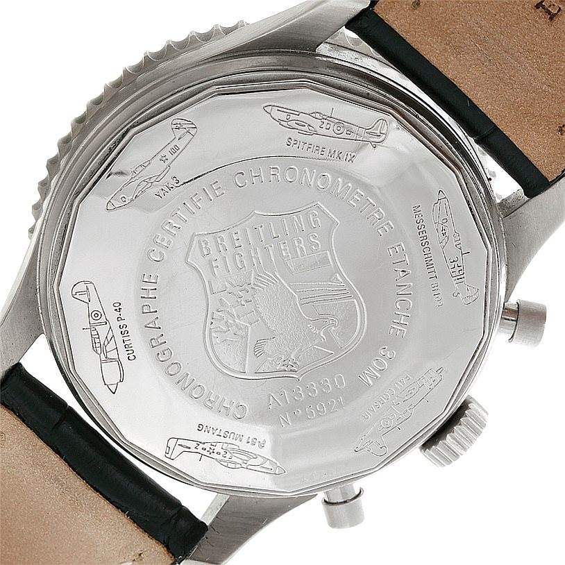 This image shows the case back of a Breitling Navitimer A13330 Men's Stainless Steel Silver Dial A13330 Men's Stainless Steel Silver Dial watch with various aircraft engravings and the Breitling logo.