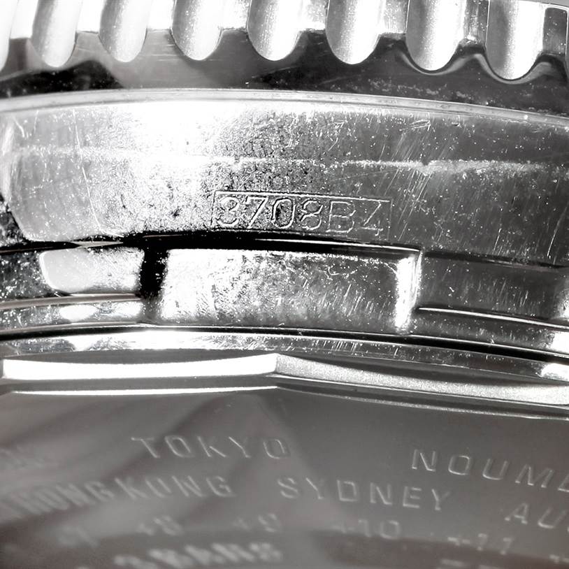 The image shows a close-up of the case back and part of the bezel of a Breitling Navitimer A24322 Men
s Stainless Steel Black Dial A24322 Men
s Stainless Steel Black Dial watch.
