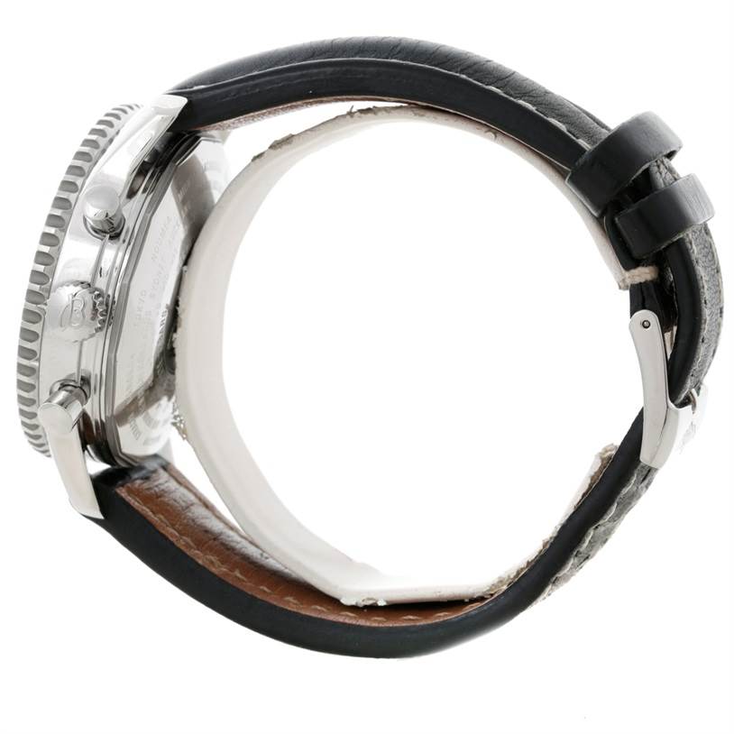 The image shows a side angle of a Breitling Navitimer A24322 Men
s Stainless Steel Black Dial A24322 Men
s Stainless Steel Black Dial watch highlighting the crown, case, and leather strap with a buckle.