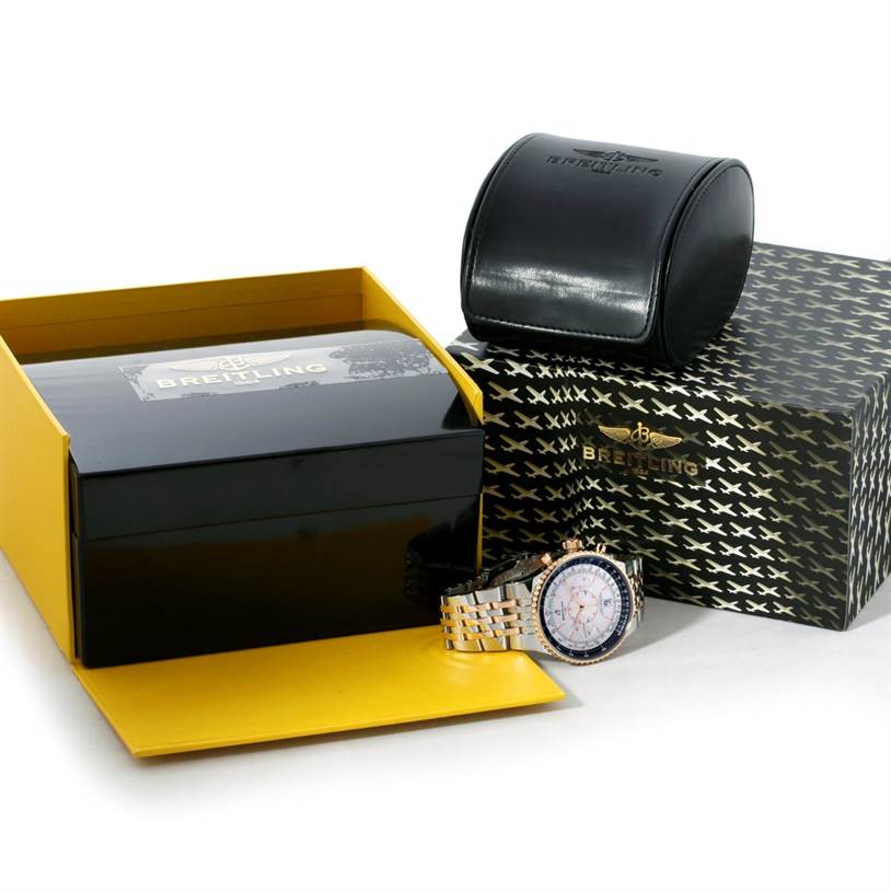 The Breitling Navitimer C23340 Men's Steel and Gold (two tone) Silver Dial C23340 Men's Steel and Gold (two tone) Silver Dial watch is displayed with its packaging, including a box and a leather case, shown from an angled view.