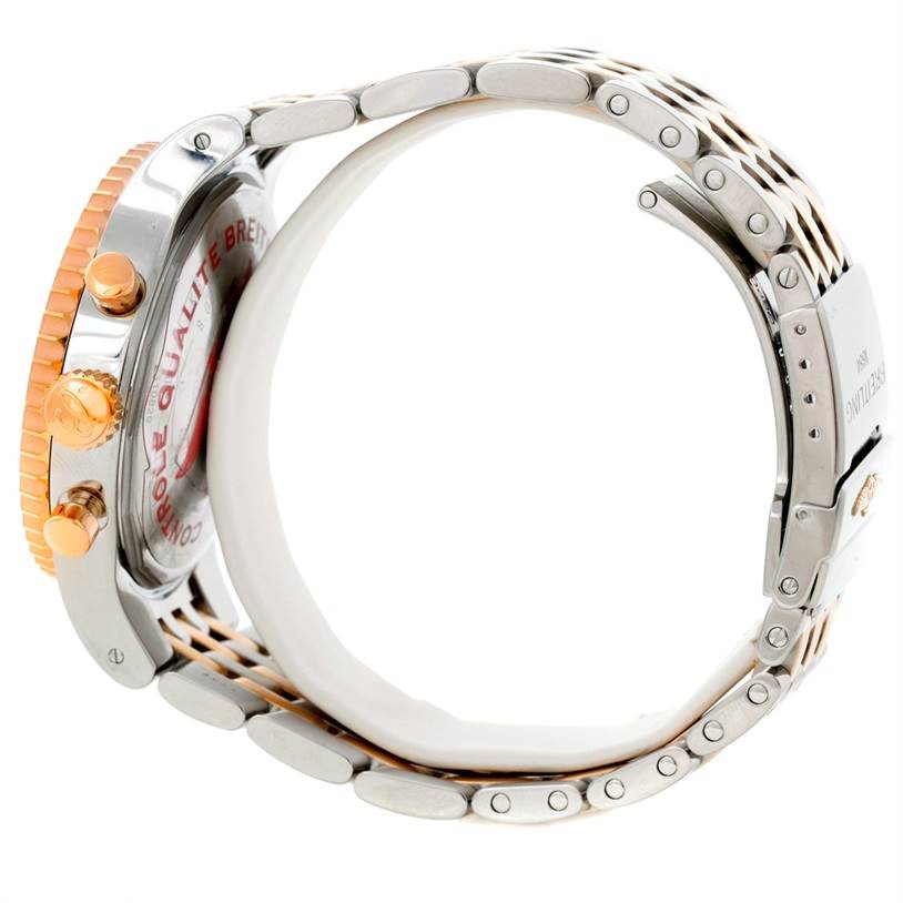 This image shows the side view of the Breitling Navitimer C23340 Men's Steel and Gold (two tone) Silver Dial C23340 Men's Steel and Gold (two tone) Silver Dial watch, highlighting the case, crown, pushers, and a portion of its metal bracelet.